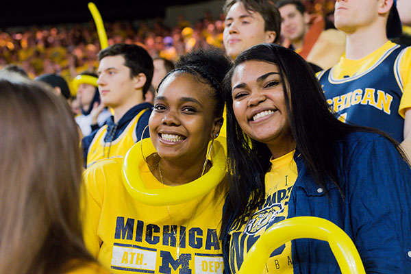 A pair of student fans at a game