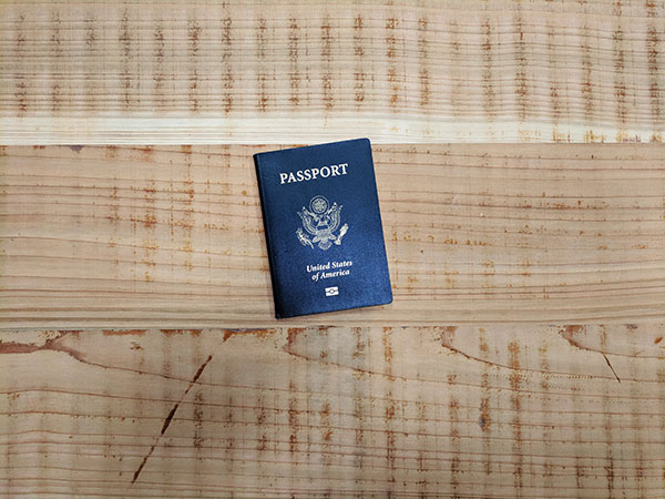 A U.S. passport on a wooden table